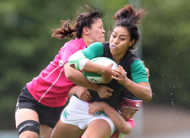 Sene Naoupu is tackled by Iroha Nagata and Ayaka Suzuki