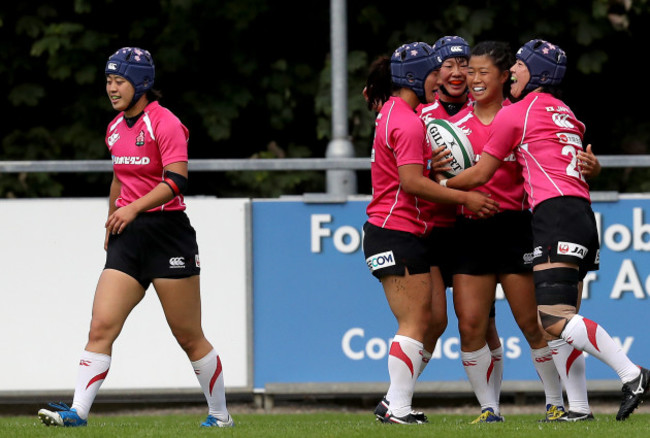 Noriko Taniguchi celebrates a try with her team mates