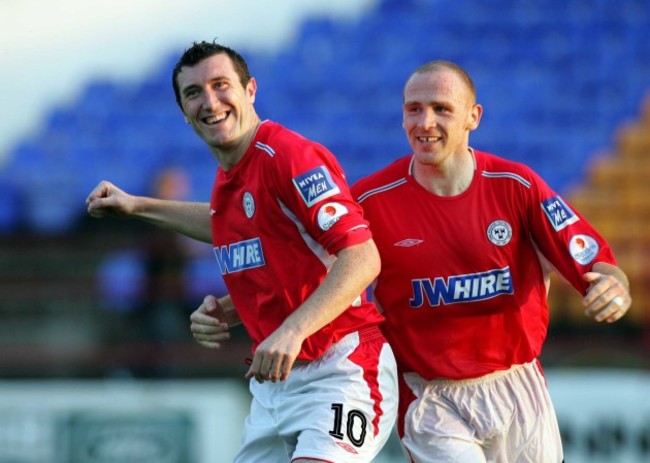 Jason Byrne celebrates scoring a goal with Glenn Crowe