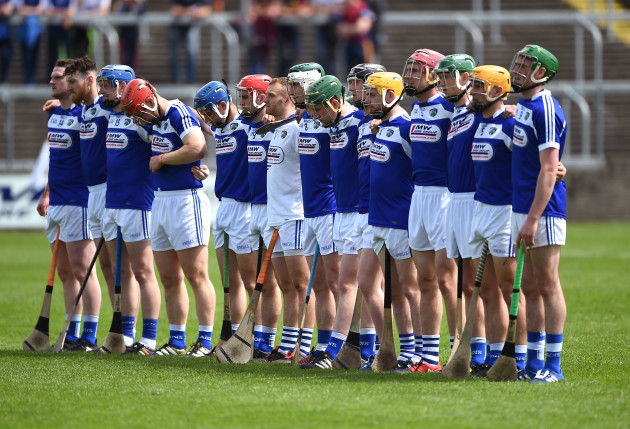 Laois players stand for the national anthem
