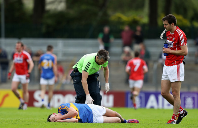 Michael Quinlivan down injured from falling awkwardly