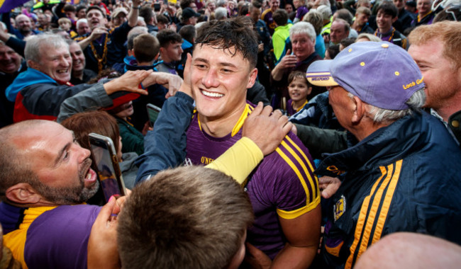 Lee Chin celebrates with fans