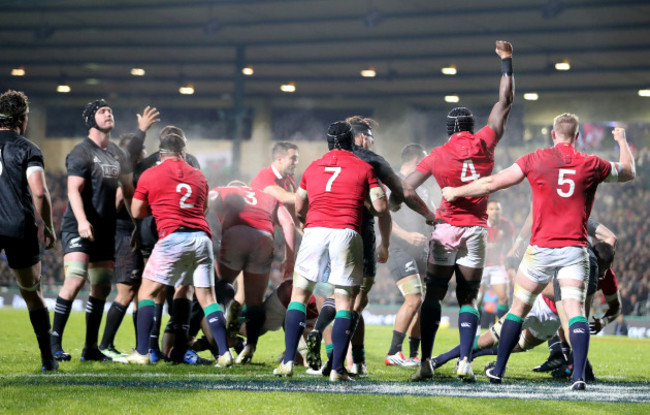 Lions players celebrate scoring a penalty try