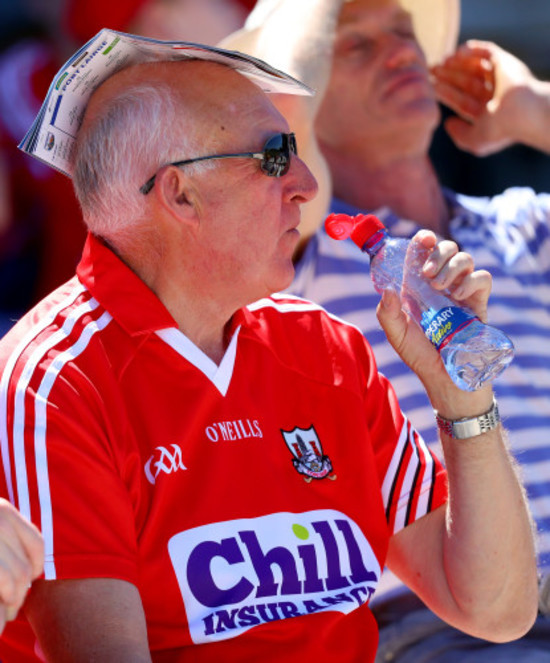 A Cork fan uses his programme to shade the sun