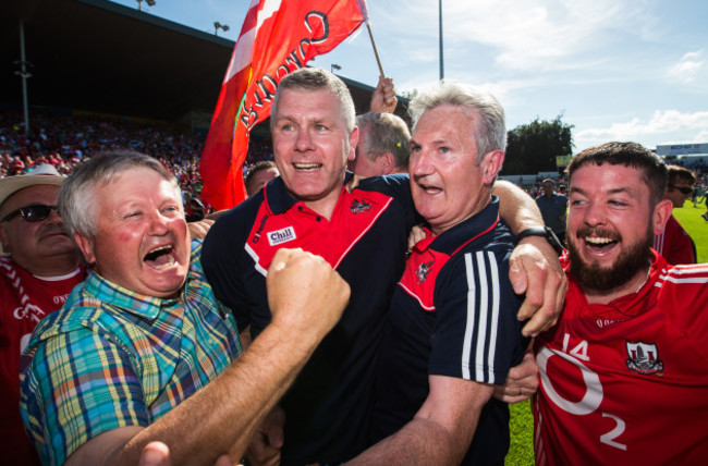 Kieran Kingston and assistant manager Diarmuid O'Sullivan celebrates at the final whistle