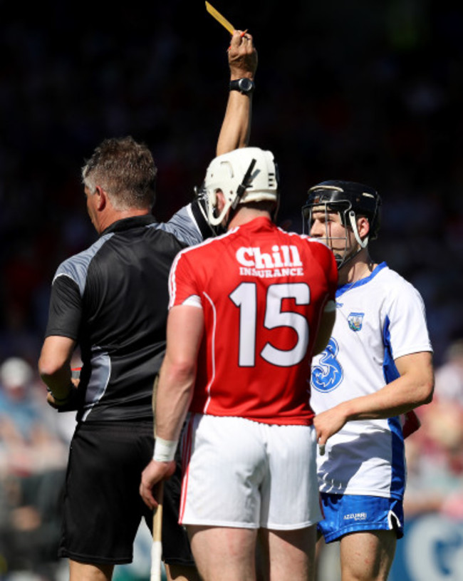 Jamie Barron is yellow carded by Barry Kelly