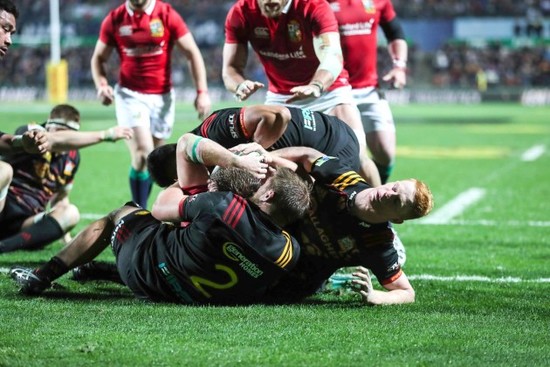 Iain Henderson is held up over the line as the team are awarded a penalty try