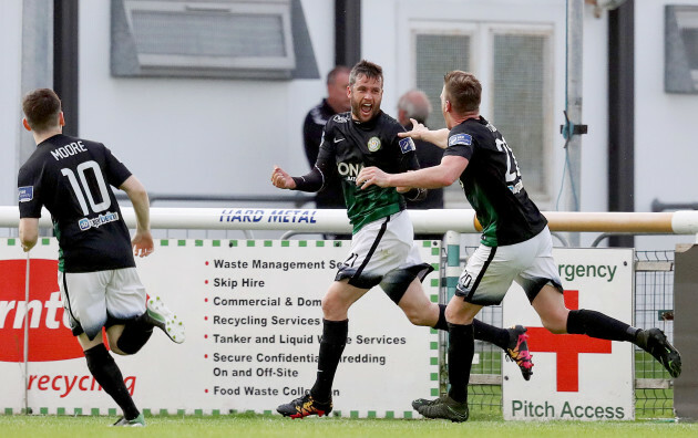 Tim Clancy celebrates scoring a goal with teammates