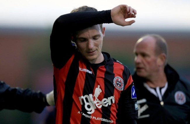 Derek Pender leaves the filed with an injury