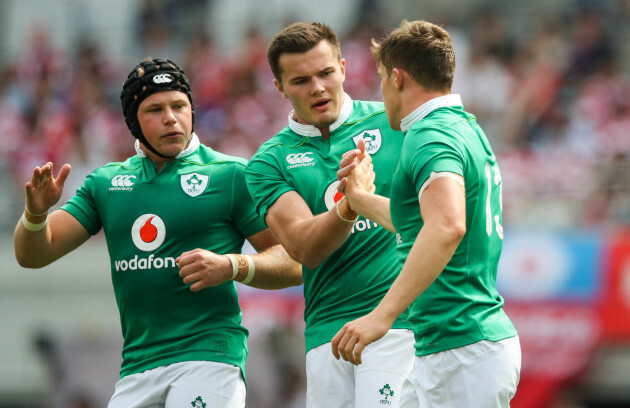 Garry Ringrose celebrates scoring the first try of the game with Luke Marshall and Jacob Stockdale