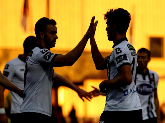 Jamie McGrath celebrates scoring a goal with Robbie Benson