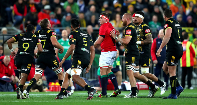CJ Stander surrounded by Hurricanes players