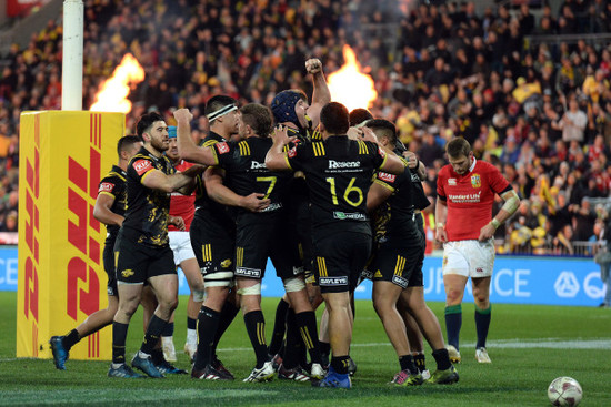 Vaea Fifita celebrates scoring their fourth try with teammates