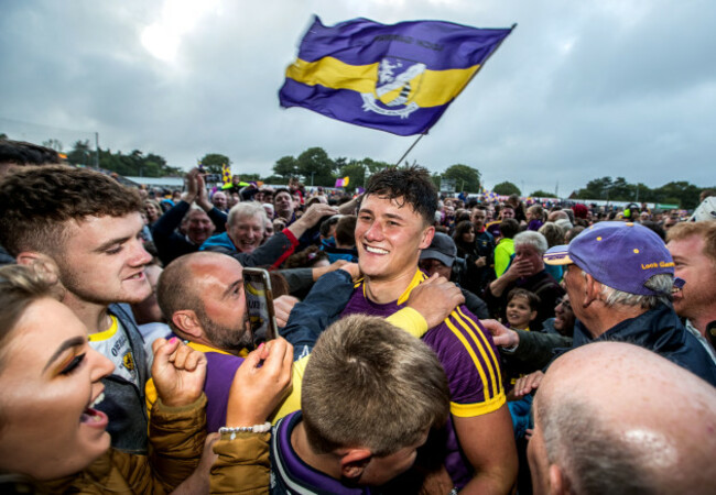 Lee Chin celebrates with fans