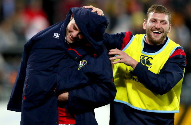 Finn Russell jokes with Robbie Henshaw as he leaves the field at half time