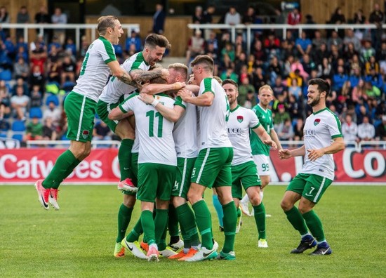 Garry Buckley celebrates scoring their first goal with teammates