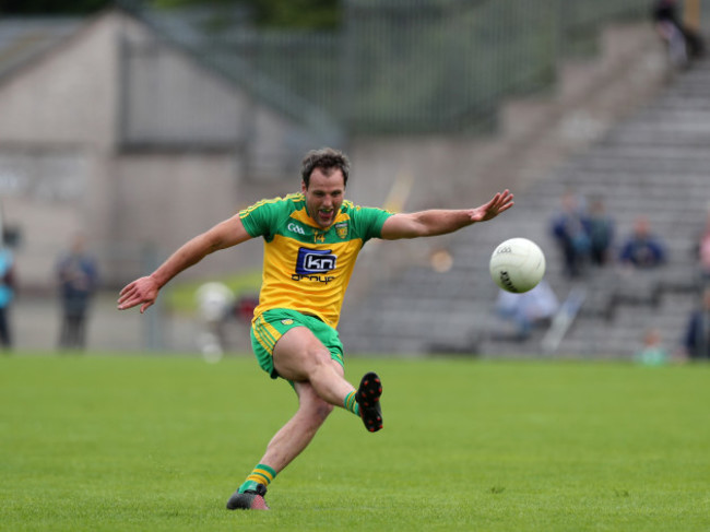 Michael Murphy kicks a free