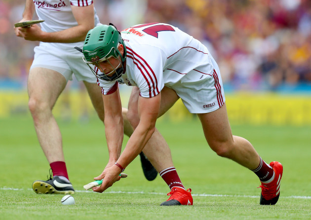 Niall Burke attempts to play with a broken hurl