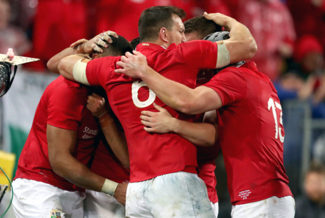 Taulupe Faletau celebrates scoring their first try with teammates