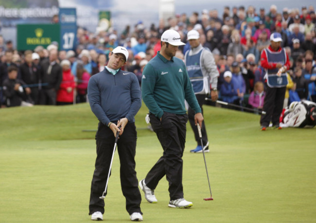 Rory McIlroy reacts after missing a putt on the 18th