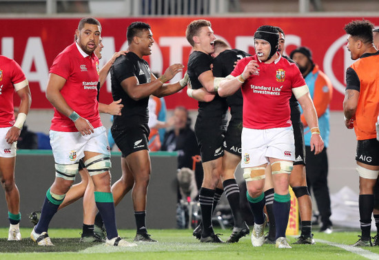 Jordie Barrett celebrates scoring their second try with Beauden Barrett and Julian Savea