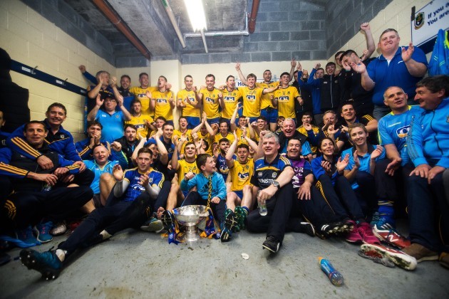 Roscommon celebrate after the game in the changing room with the trophy