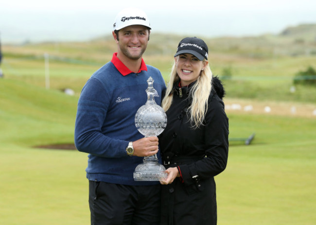 Jon Rahm celebrates his victory with partner Kelley Cahill