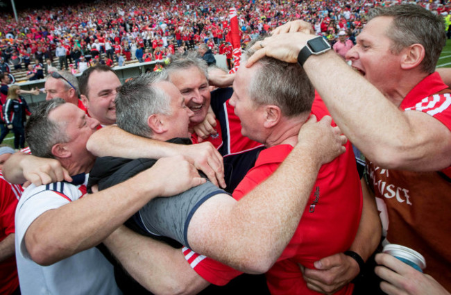 Kieran Kingston celebrates with Diarmaid O'Sullivan at the final whistle