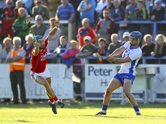 Patrick Curran shoots under pressure from Paul Leopold