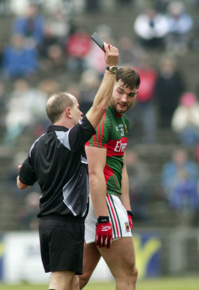 Eddie Kinsella shows Aidan O'Shea a black card