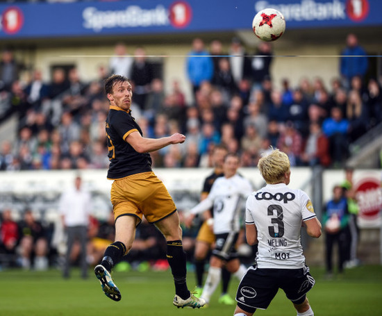 David McMillan directs a header towards goal