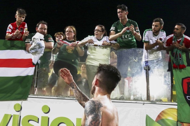 Sean Maguire gives his jersey to a young fan after playing his last game for the club
