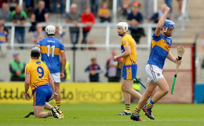 Tony Kelly looks on as John McGrath celebrates scoring a point