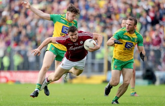 Damien Comer with Neil McGee and Kieran Gillespie