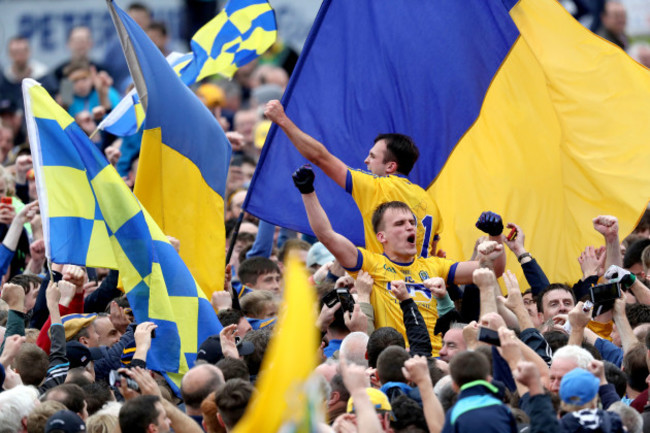 Enda Smith and Donal Smith celebrate with supporters in the crowd after the game