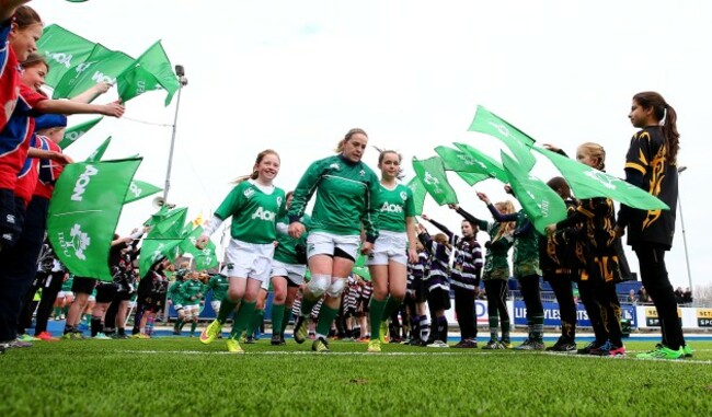 Niamh Briggs runs out with Katie Cashman and Lucy Collins
