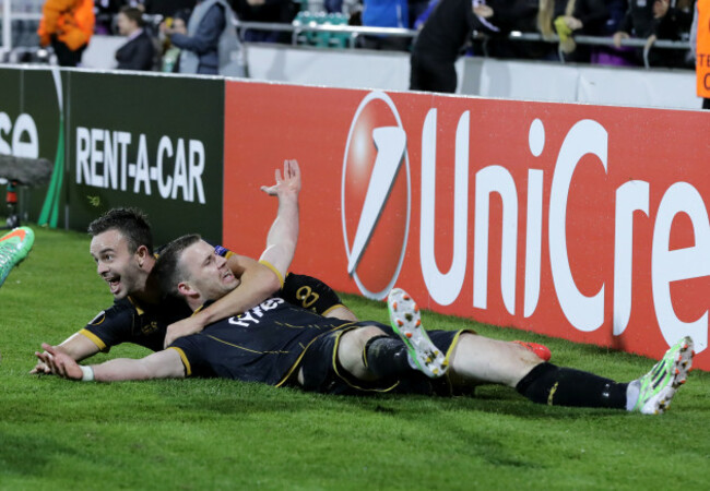 Ciaran Kilduff celebrates scoring a goal with Robbie Benson