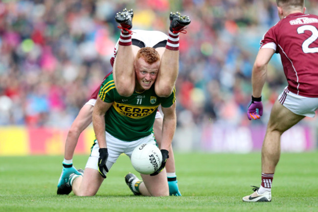 Johnny Buckley is tackled by Gary O'Donnell