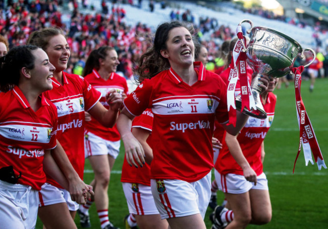 Ciara O'Sullivan with the trophy as the team celebrates