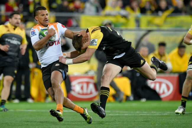 Carl Wegner is tackled by Beauden Barrett