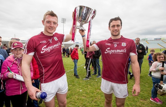 Galway's Joe Canning with captain David Burke celebrate winning the Division 1 trophy