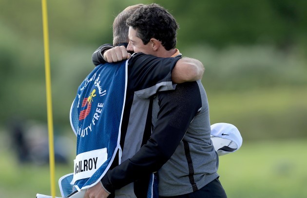 Rory McIlroy celebrates with caddie JP Fitzgerald after winning The Irish Open