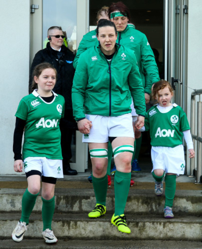 Paula Fitzpatrick leads the team out with the two mascots