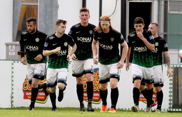 Tim Clancy celebrates scoring a goal with teammates