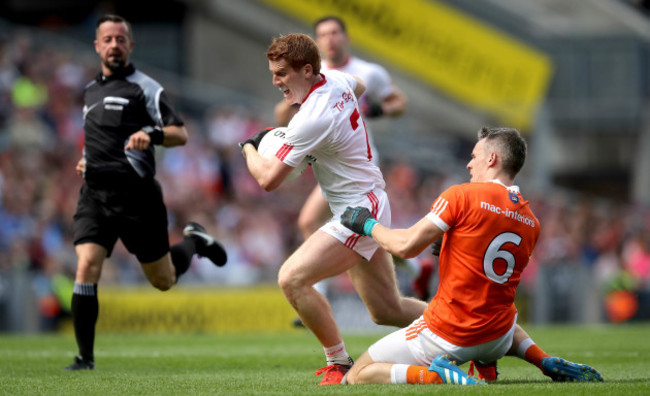 Mark Shields fouls Peter Harte and is black carded