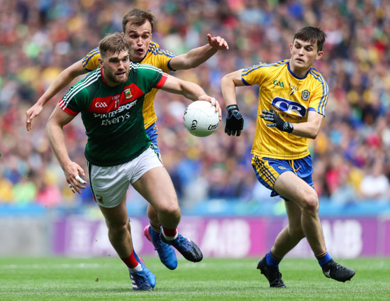 Aidan O'Shea with  Enda Smith and Brian Stack