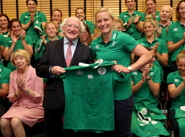 President of Ireland Michael D. Higgins gets presented a jersey by Ireland captain Claire Molloy