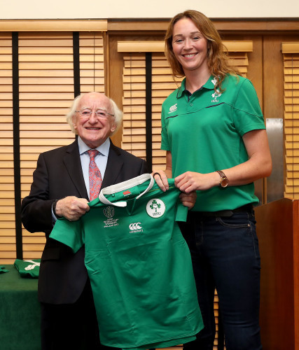 President of Ireland Michael D. Higgins presents a jersey to Marie-Louise Reilly