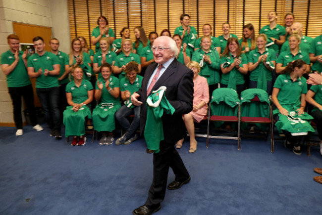 President of Ireland Michael D. Higgins gets presented a jersey by Ireland captain Claire Molloy