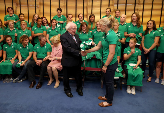 President of Ireland Michael D. Higgins gets presented a jersey by Ireland captain Claire Molloy